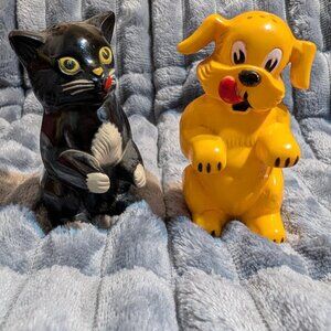 Plastic salt and pepper shakers of a yellow dog and black cat by F&F Mold